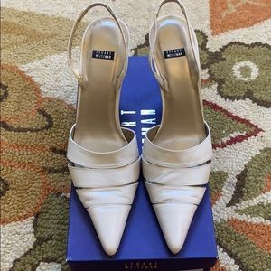 Stuart Weitzman “Tiered” cream leather heels.